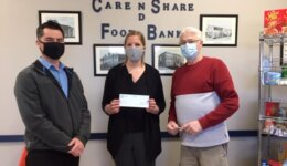 Jonathon Makes a donation to the Care & SHare Foodbank on behalf of Alarm Systems