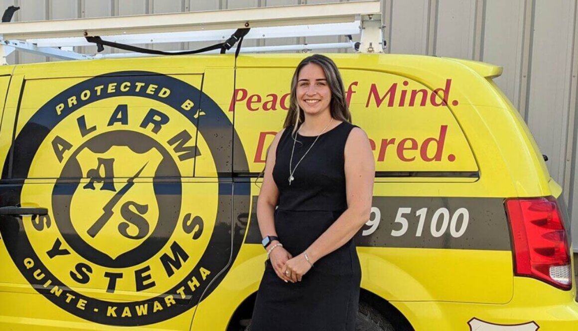 Jenna in Front of an Alarm Systems Van