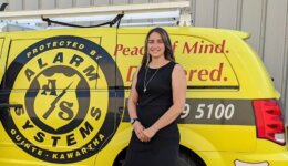 Jenna in Front of an Alarm Systems Van