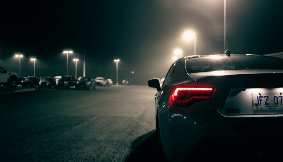 Car in dark parking lot