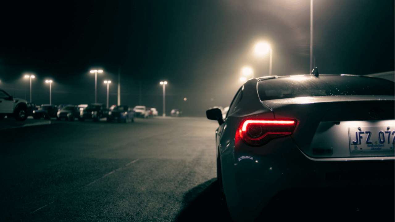 Car in dark parking lot