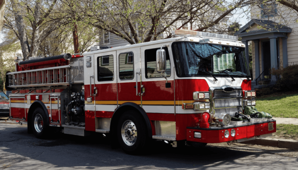 Fire truck parked in front of a home