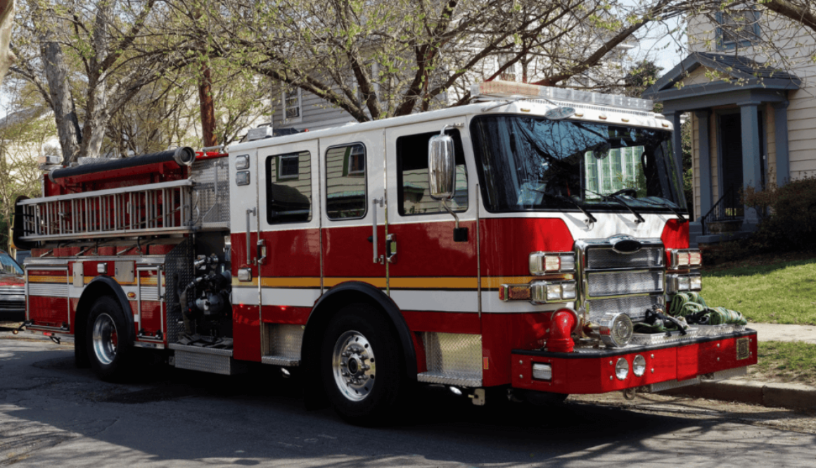 Fire truck parked in front of a home